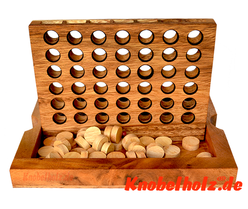 Building up before the beginning of the Connect Four strategy game Four Winning out of wood Building up before the beginning of the Connect Four strategy game Four Winning out of wood